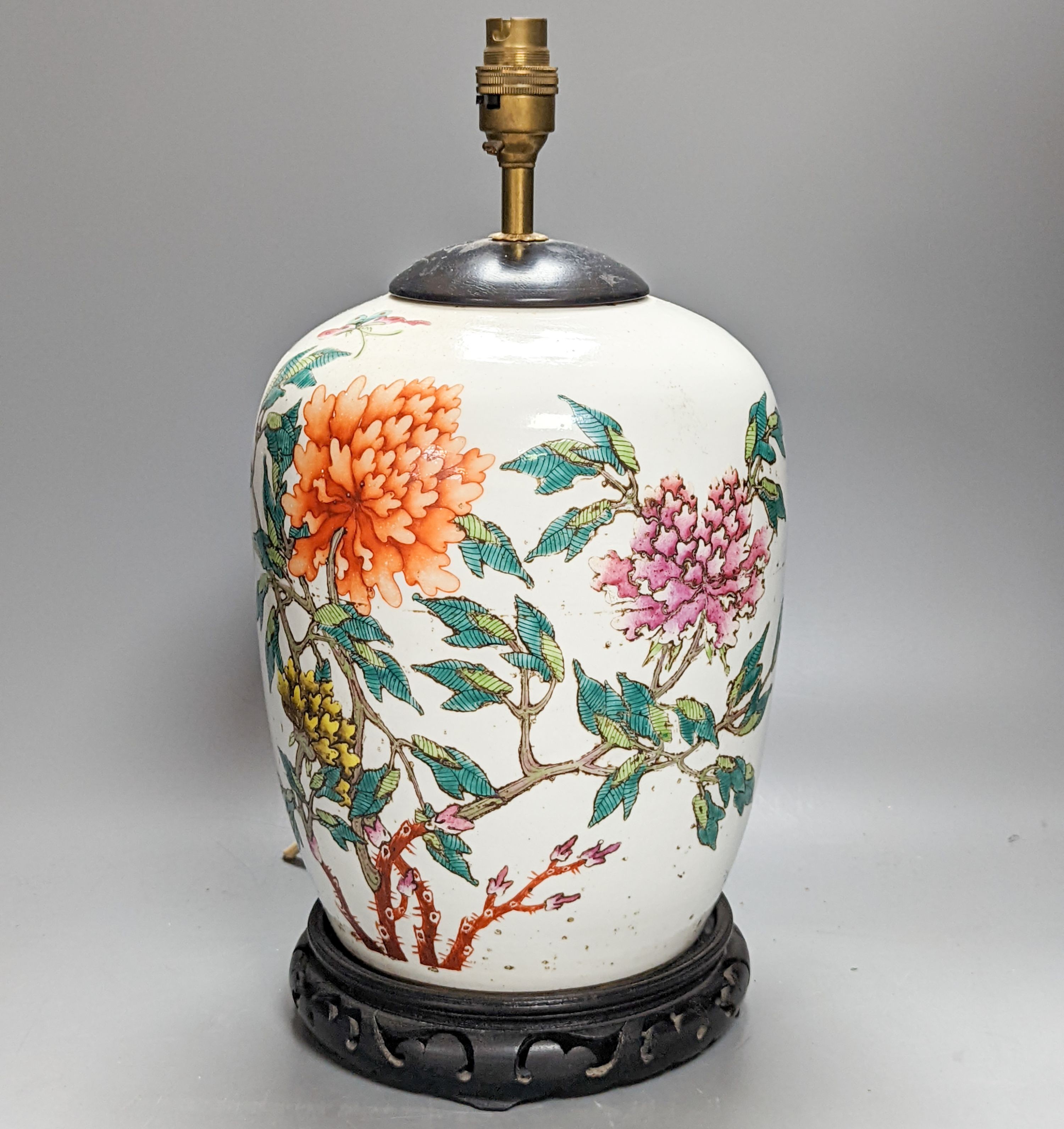 A Chinese famille rose jar now mounted as a lamp, 41 cm high to lamp fitting